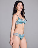 Elegant Astri lingerie set from Emma Harris is crafted from saturated blue silk and mesh with blue and green tonal floral lace appliqué