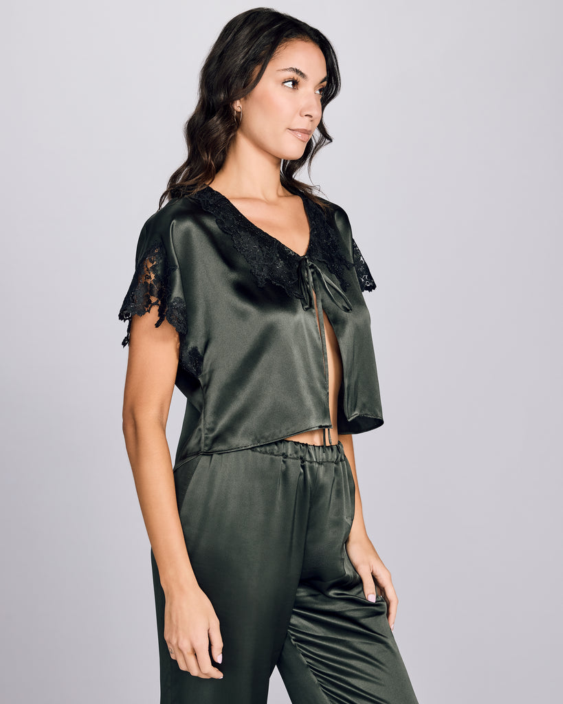 The Clara Moss bed jacket from Emma Harris has a semi-cropped fit with dolman sleeves and a silk tie closure at the neckline