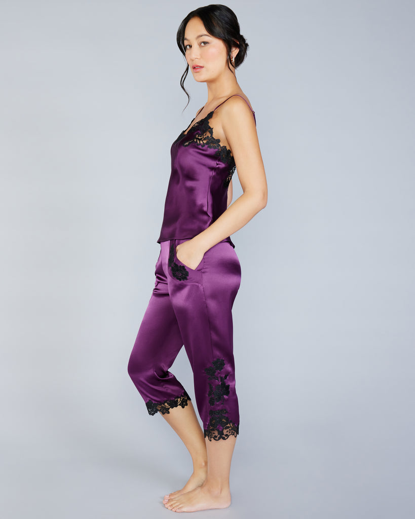 The trousers on the Clara Pajama Set from Emma Harris are capri length with an elasticized waist and lace appliqué at the cuffs and pockets