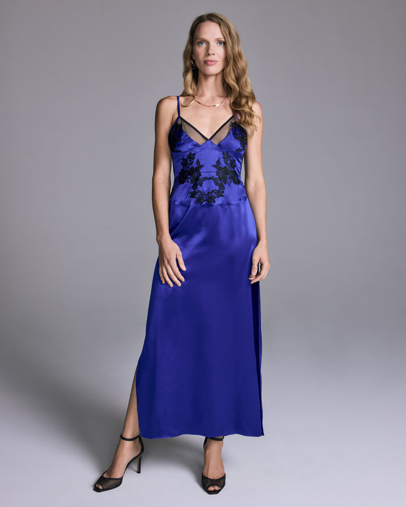 Glamorous Fallon silk gown from Emma Harris is crafted from a vibrant potion blue-purple silk with sheer black tulle and shimmering black lace appliqué
