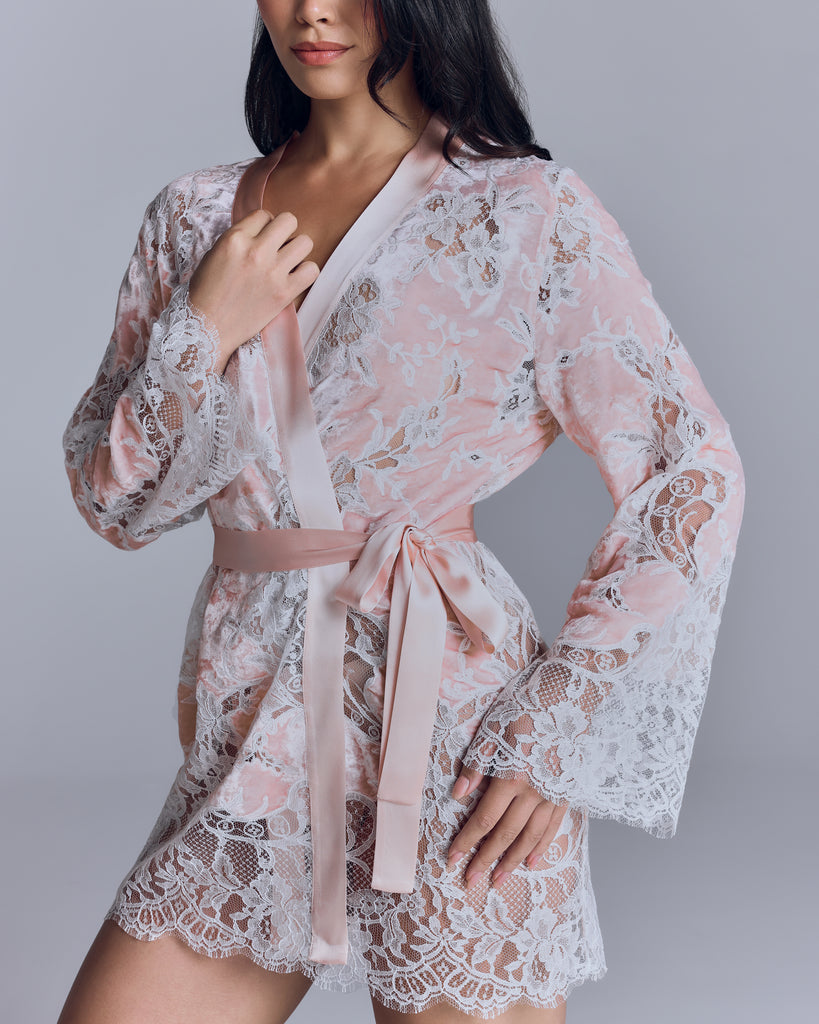 The Lily pink velvet robe from Emma Harris has pink silk binding and interior and exterior ties, wide lace panels at the sleeves and hem