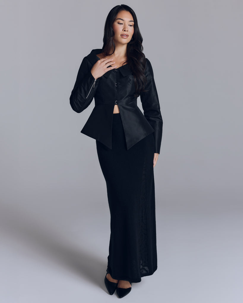 Tailored Eliette jacket from Estelle Wiele is crafted from black silk taffeta with hand-crafted silver hook and eye closures