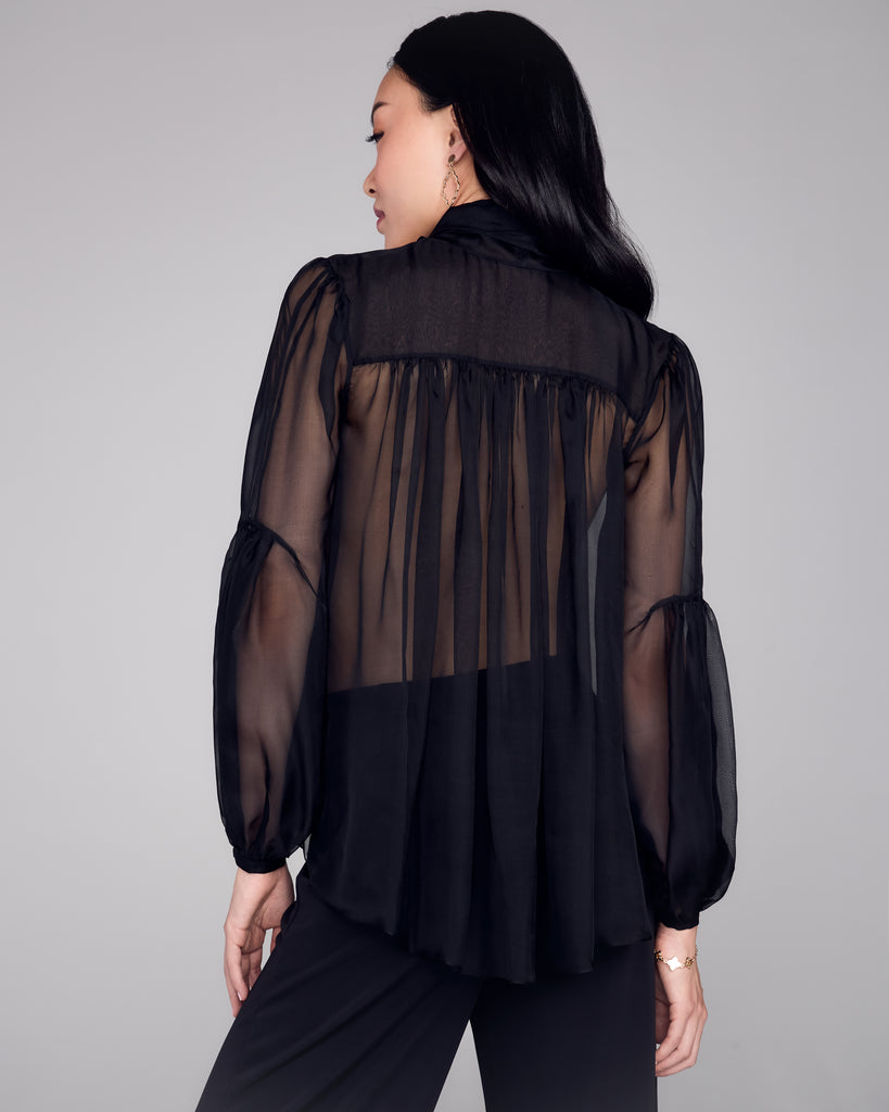 FrancesKa's Brigitte blouse has a button-down front with pleated detailing at the elbows and back