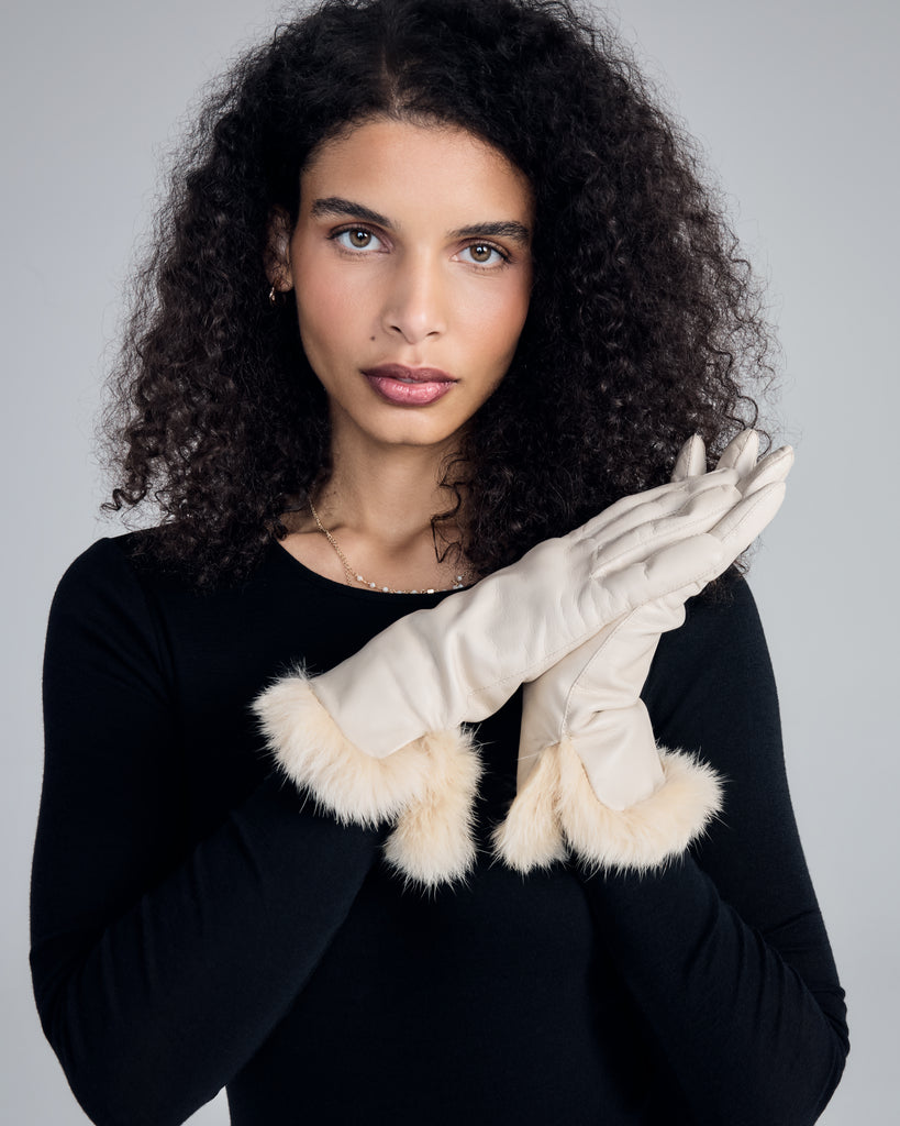 Elegant gloves from Karma are crafted from ivory lamb nappa leather with wool lining and fur cuffs