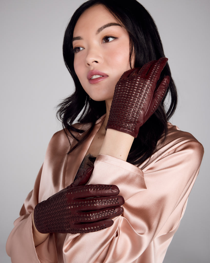 The top of the Lacey gloves from Karma features an intricate openwork pattern, stylish and breathable, while the palm is sleek Italian leather