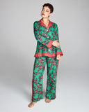 Isa Sayuri Jade cotton pajama from Karma on the Rocks is crafted from a whisper-weight teal cotton with an orange, pink and purple floral print and contrasting fuchsia and purple geometric print