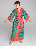 The Kobe Sayuri Jade cotton robe from Karma on the Rocks is crafted from a lightweight teal cotton with an orange, pink and purple floral print and contrasting fuchsia and purple geometric print