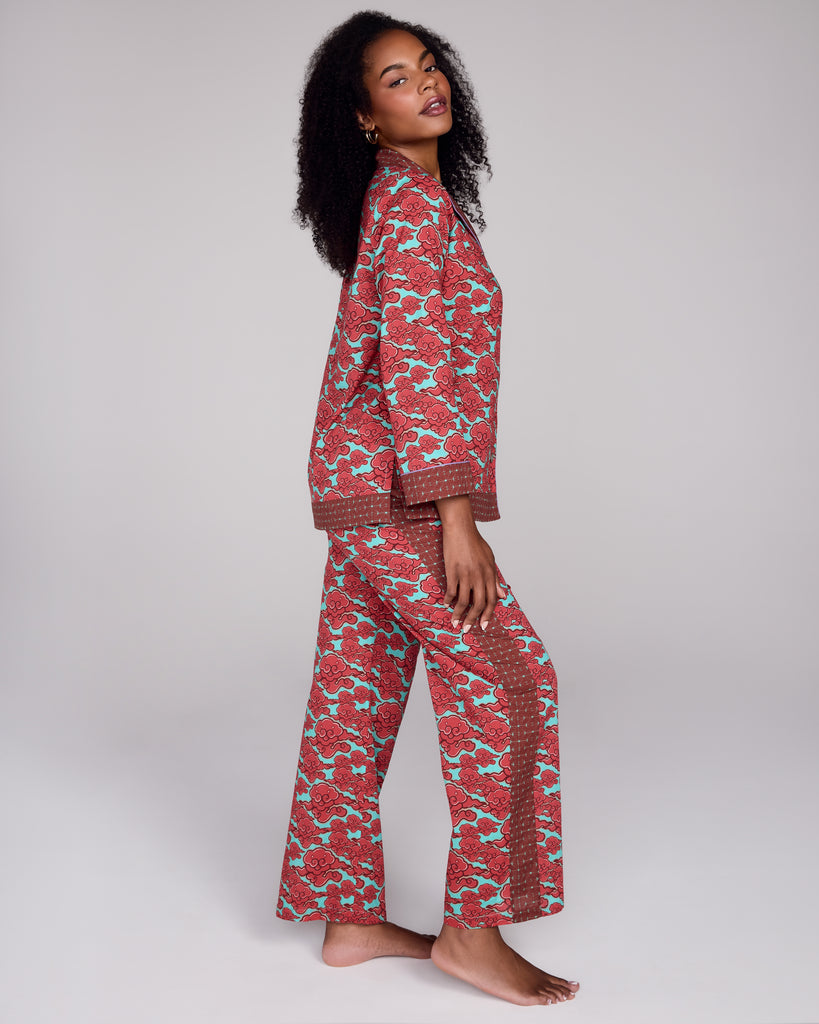 The Isa Kumo pant from Karma on the Rocks has a loose fit with a fully elasticized waist, pockets, and contrast print down the sides of the legs
