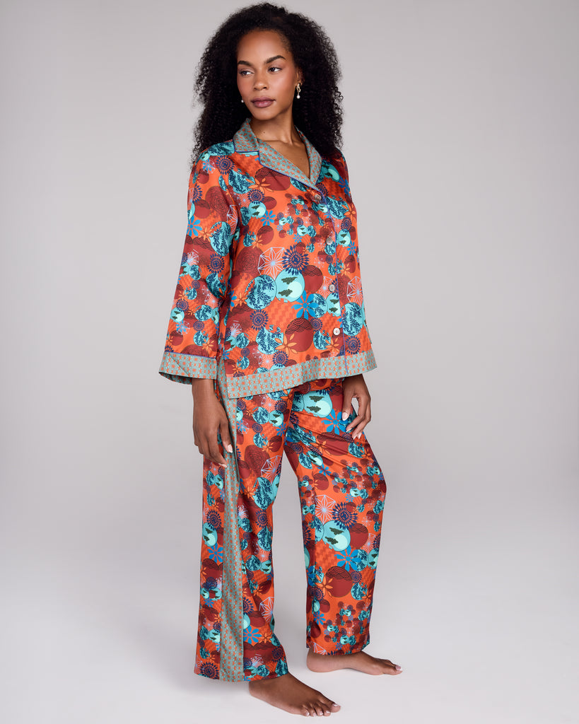 Classic button-down top on Karma's Tama Coral pajama has a generous fit with a notched collar, blue piping, and contrast print at the collar, cuffs and hem
