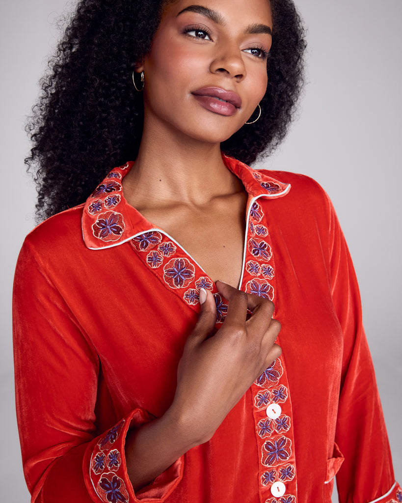 Silk velvet Tokyo pajama from Karma on the Rocks is crafted from a vibrant red silk velvet with a geometric floral embroidery in shades of silver, gold, and purple