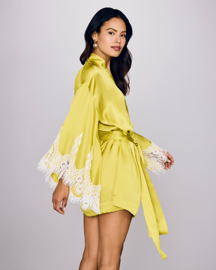 Classic Arielle short robe from Layalina is crafted from neon chartreuse silk with lavish ivory lace appliqué at the sleeves 