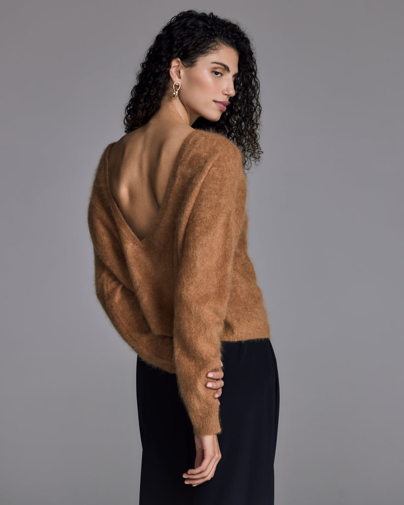 The Sensual Dive sweater from Raev Paris has an intentionally boxy fit, with the V neckline designed to be reversible: worn either to the front or to the back