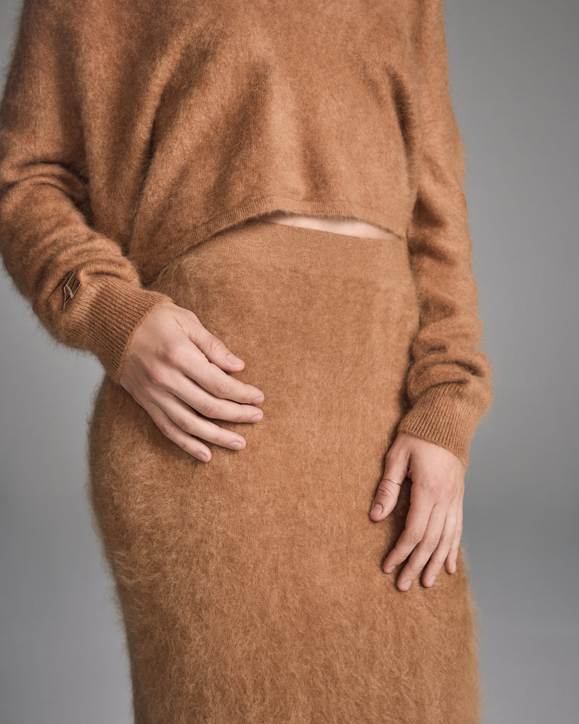 Sleek knit smoking skirt by Raev Paris is crafted from a sumptuous brushed camel Mongolian cashmere