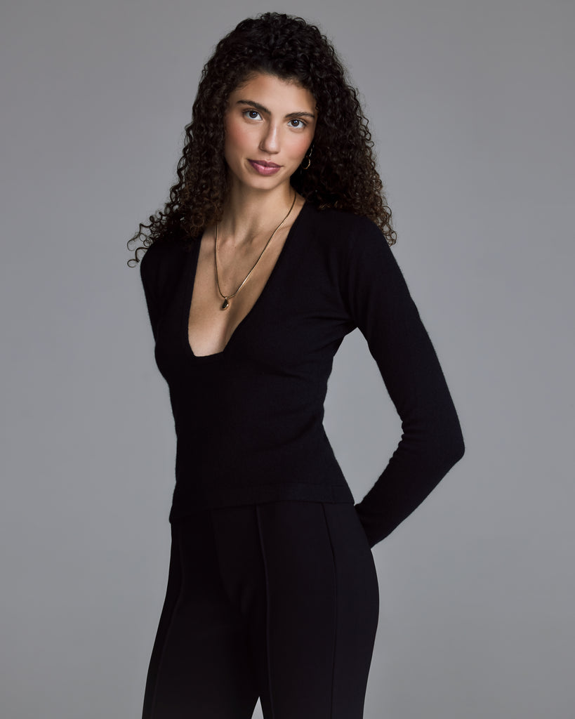 Black sculpted temptation wool-cashmere sweater from Raev has a unique plunging v neckline with a flat end, perfect for showing off a beautiful bra