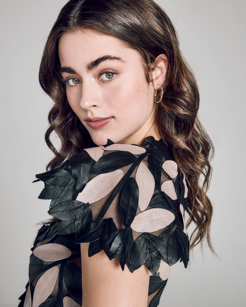 Zambak's flat leaf shrug top is short sleeved with a cropped fit and a single front button closure