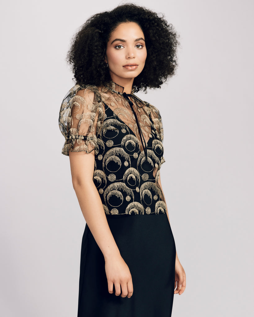 Gilda & Pearl's RSVP Top has dramatic puff sleeves with elastic on the arms for fit
