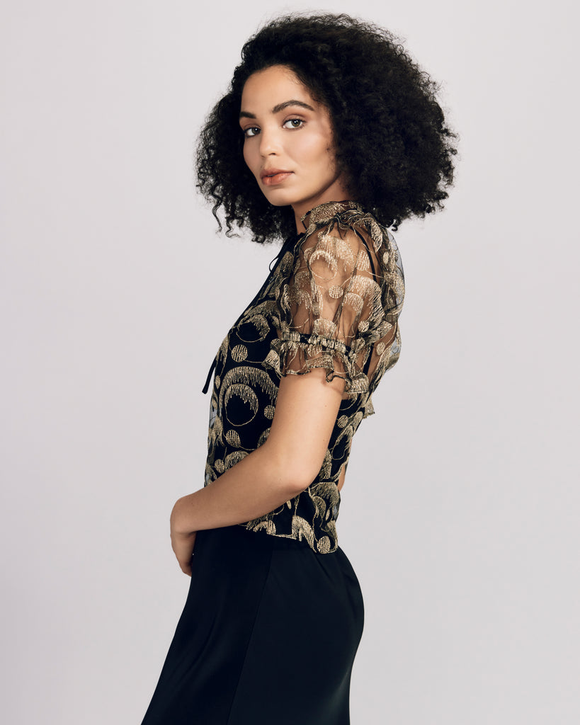 Gilda & Pearl's RSVP Top has a ruffled high neckline has a keyhole at the front and ties with a black silk tie