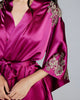 Fuchsia silk Celeste kimono robe from Emma Harris is embellished with shimmering gold lace appliqué at the sleeves, shoulder, back, and bottom of the matching silk belt