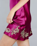 Celeste Raspberry slip from Emma Harris is crafted from fuchsia silk with shimmering gold floral lace appliqué