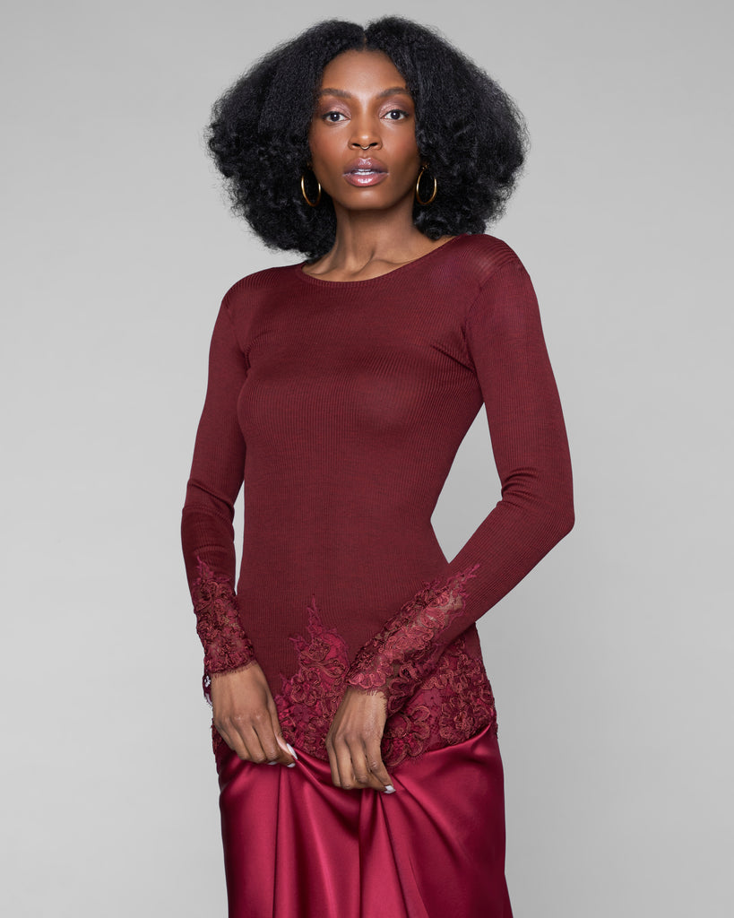 Burgundy red lace insets at the sleeves and hem of this top from Dana Pisarra are further embellished with soutache detailing