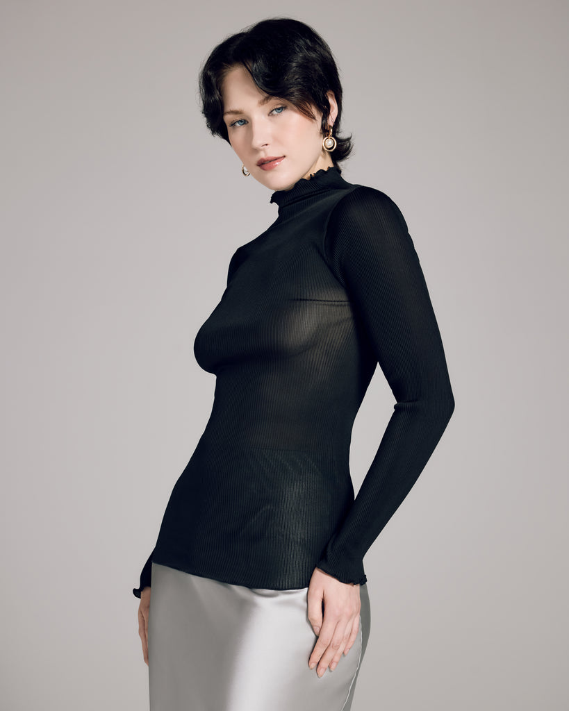 Luxe black long-sleeved, mock-neck top from Aromatique is crafted from a ribbed 100% silk