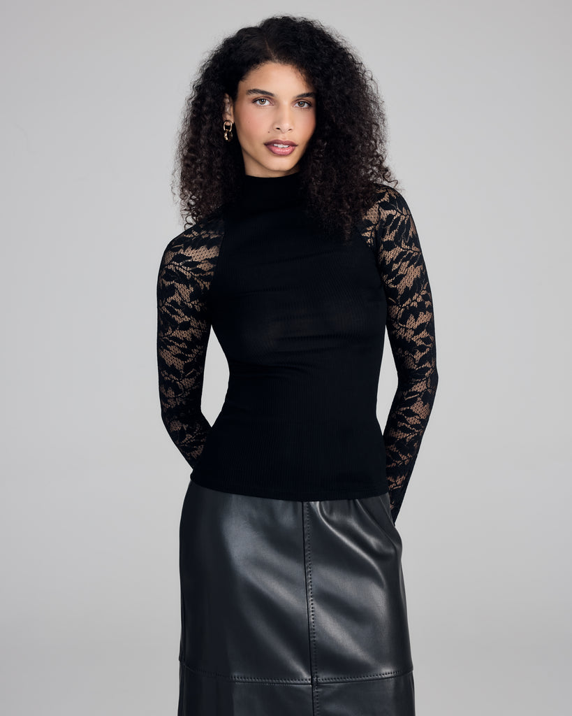 Elegant top from Aromatique is crafted from a black ribbed 100% cotton with a mock turtleneck and transparent lace sleeves