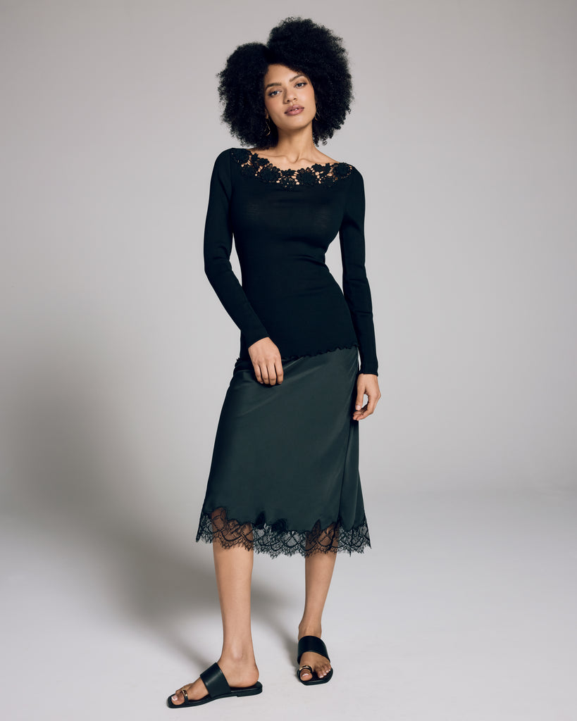 Boglietti's Brianna black long sleeve is crafted from a ribbed knit silk wool blend with floral detailing at the boat neckline