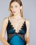 The Erte  gown from Christine Vancouver is crafted from vibrant teal silk with black lace inspired by peacock feathers