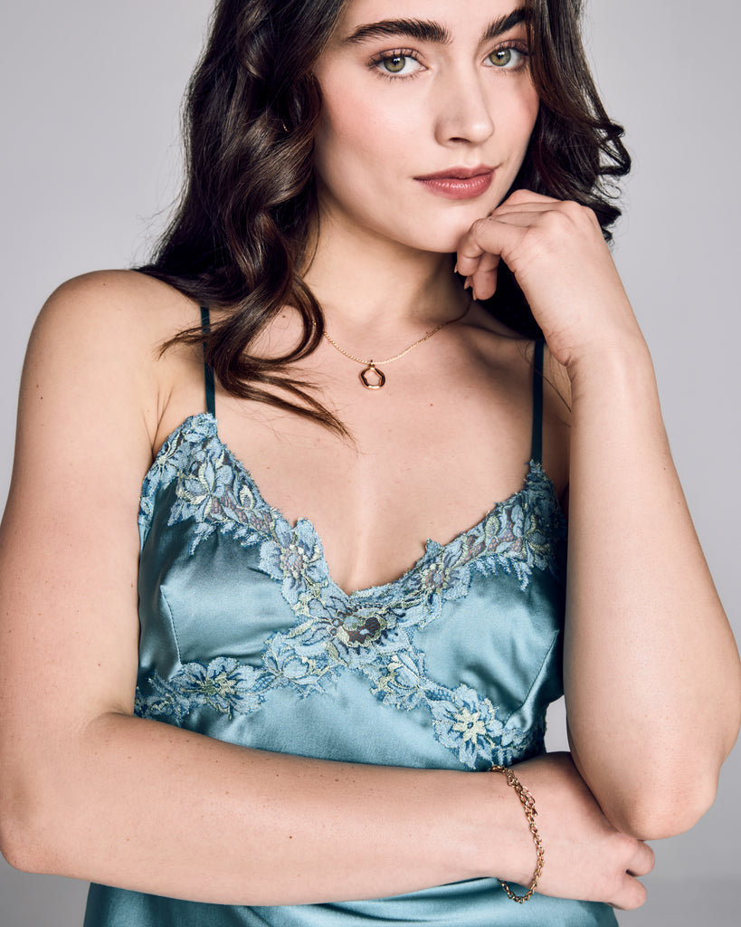 Slightly cropped Astri camisole from Emma Harris has a vee neckline with lace appliqué accenting the bust and wrapping around to the back