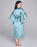 The Astri robe from Emma Harris has 3/4 kimono sleeves, belt closure, hits at the calf.  