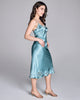 Luxurious Astri slip dress from Emma Harris is crafted from vibrant blue silk with tonal blue and green floral lace appliqué 