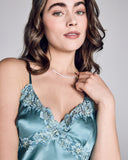 Lace appliqué adorns the vee neckline of the Astri slip dress from Emma Harris and wraps around to the gracefully scooped back
