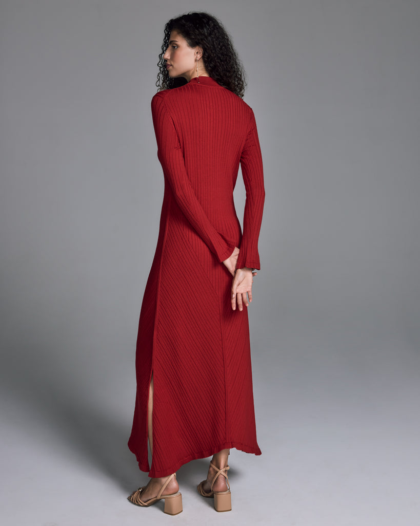John Smedley's Eilean Ruby sweater dress has a mock neck and hits around the ankle on most with side slits at the slightly asymmetric hemline