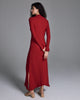 John Smedley's Eilean Ruby sweater dress has a mock neck and hits around the ankle on most with side slits at the slightly asymmetric hemline