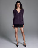 The Jeune Plum cardigan sweater from John Smedley is a long sleeved design with a vee neck and classic button down front