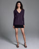 The Jeune Plum cardigan sweater from John Smedley is a long sleeved design with a vee neck and classic button down front
