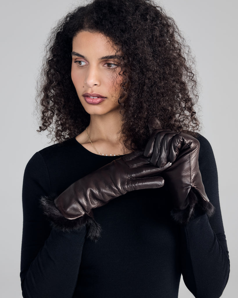Elegant gloves from Karma are crafted from chocolate brown lamb nappa leather with wool lining and fur cuffs