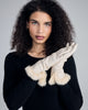 Elegant gloves from Karma are crafted from ivory lamb nappa leather with wool lining and fur cuffs