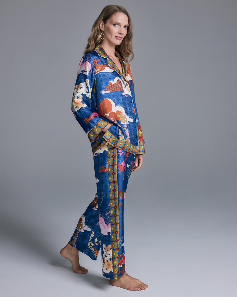 The classic button-down top on the Isa Tori Blue Silk Pajama has a generous fit with a notched collar, white piping, and contrast print at the collar, cuffs and hem