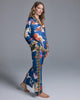The classic button-down top on the Isa Tori Blue Silk Pajama has a generous fit with a notched collar, white piping, and contrast print at the collar, cuffs and hem