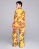 Karma's Isa Yuri Yellow silk pajama pant has a loose fit with a fully elasticized waist, pockets, and contrast print down the sides of the legs