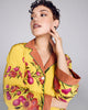 Exquisite Isa Yuri Yellow silk pajama from Karma on the Rocks is crafted from a bright yellow silk twill with a pink and orange floral print, with a contrasting psychedelic geometric print in shades of yellow, orange and purple