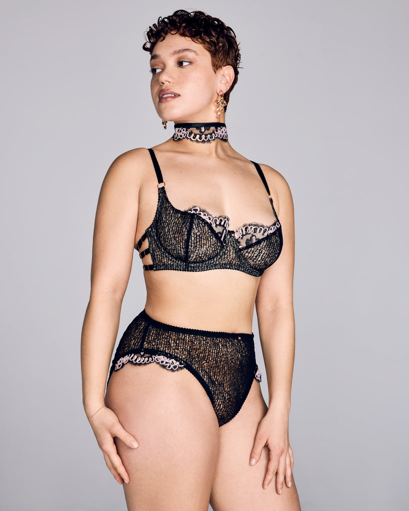 Karolina Laskowska's Selenę Couture Lingerie set is crafted from an abstract “circuit board” corded black lace and scalloped lace trim accented with iridescent sequins, showing as pink, yellow, green or orange depending on the light