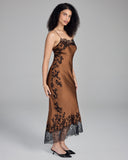 Full-length slip dress from Merle Noir is crafted from a warm bronze silk with lavish black lace appliqué throughout