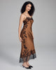 Full-length slip dress from Merle Noir is crafted from a warm bronze silk with lavish black lace appliqué throughout