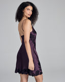 Rich purple chemise from Merle Noir showcases magnificent black floral lace appliqué at the neckline and hem