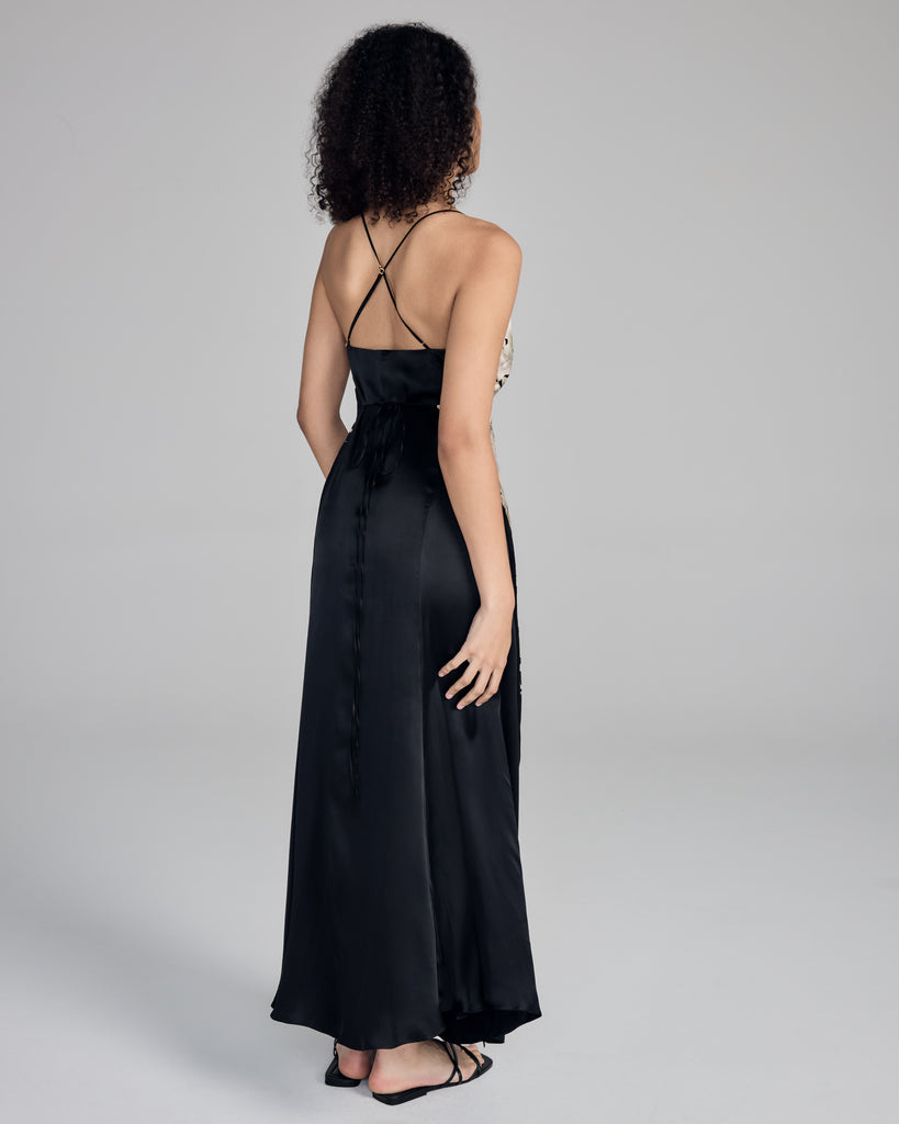 Designed to be wrappable with either side on top, this dress from Merle Noir has adjustable slim silk spaghetti straps that cross in the back, and slim silk ties wrap that around the waist