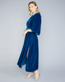 The Stelios Koudounaris Flared Sleeves dress is crafted from a saturated teal velvet