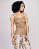 Aromatique's gold ribbed silk camisole is seamless through the body, with satin binding at the v-neckline and adjustable spaghetti straps