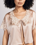 The Clara Bed Jacket from Emma Harris has lace applique at the sleeves and a truly exceptional appliquéd lace collar